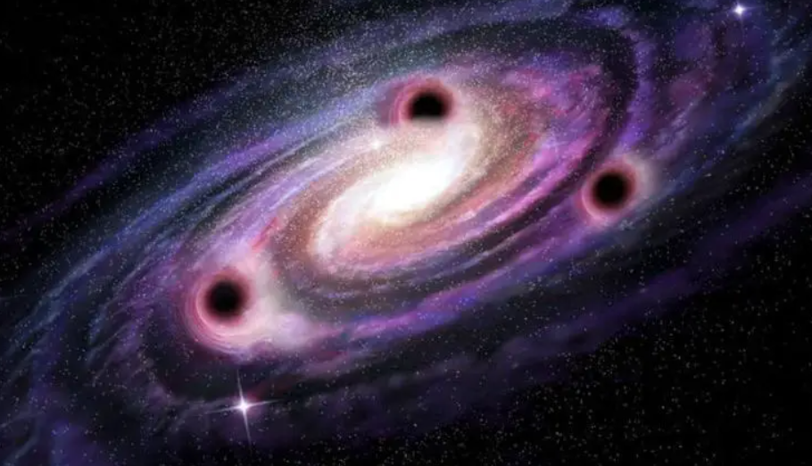 3 supermassive black holes, each with a mass over 90 million Suns, found in a single galaxy